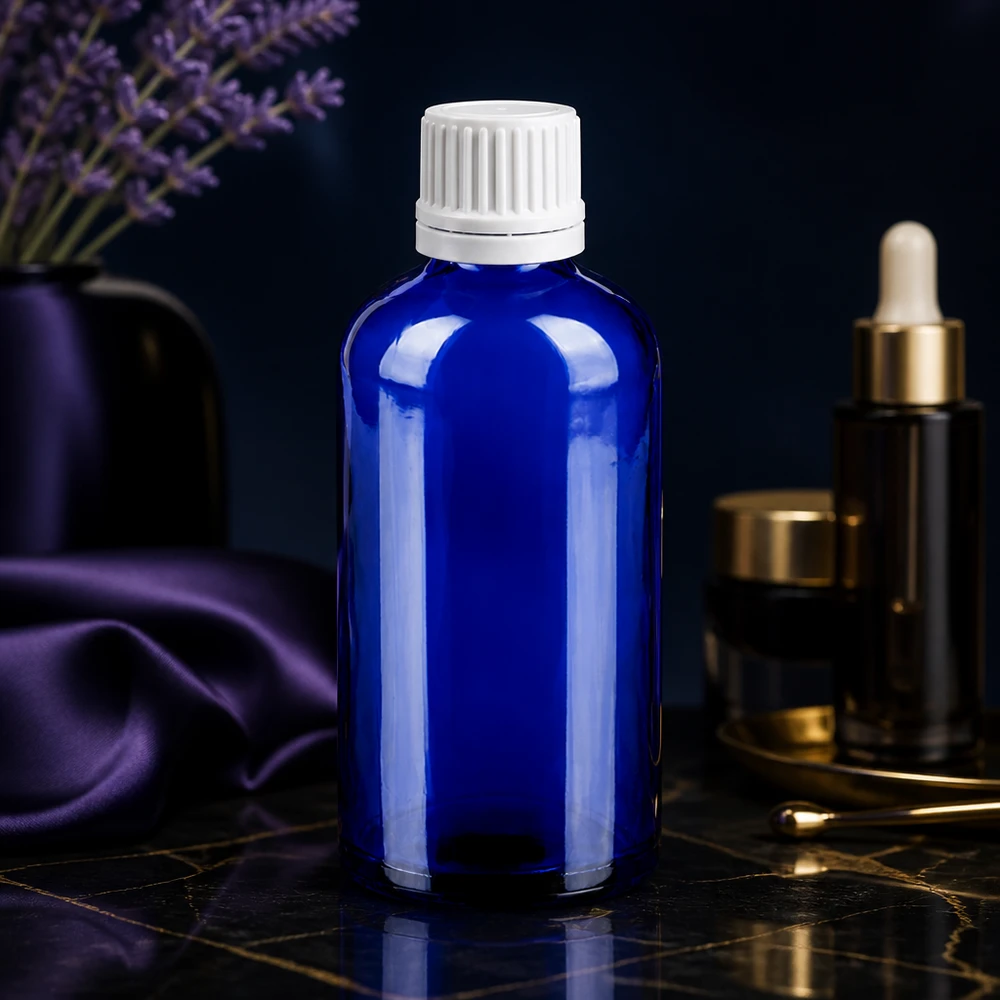 Precyzyjna butelka z zakraplaczem 100 ml wykonana z niebieskiego szkła chroniącego przed promieniowaniem UV z białą zakrętką dla laboratoriów i aptek