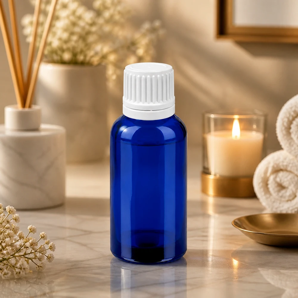 30 ml niebieska butelka z zakraplaczem i białą nakrętką do olejków eterycznych i aromaterapii