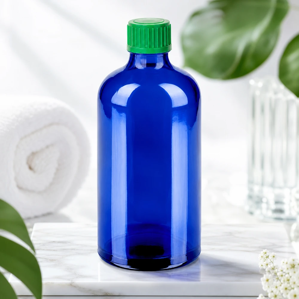 100 ml butelka z zakraplaczem 0,8 mm zielona STD BlueLine UT18/100 Wysokiej jakości butelka z zakraplaczem BlueLine 100 ml wykonana z ciemnoniebieskiego szkła z zieloną zakrętką chroniącą przed promieniowaniem UV.