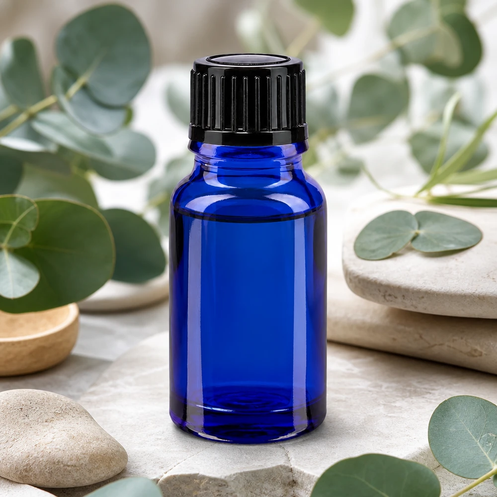 Kobaltowo-niebieska buteleczka z zakraplaczem ApoGlas o pojemności 10 ml z czarną zakrętką do aromaterapii