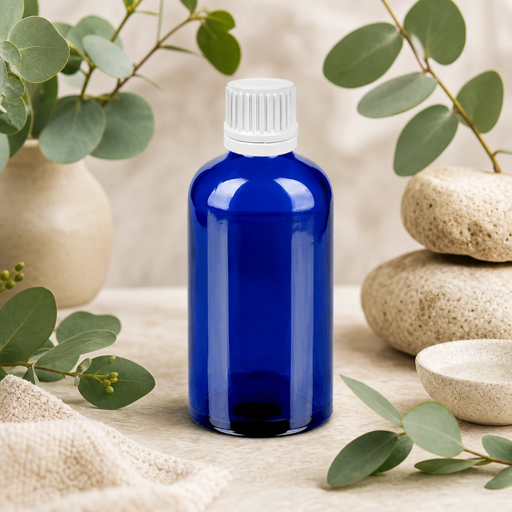 100 ml kroplówka 0,7 mm biała OV BlueLine UT18/100 Elegancka niebieska szklana butelka 100 ml z białą zakrętką z kroplomierzem - idealna do kosmetyków DIY i pielęgnacji skóry
