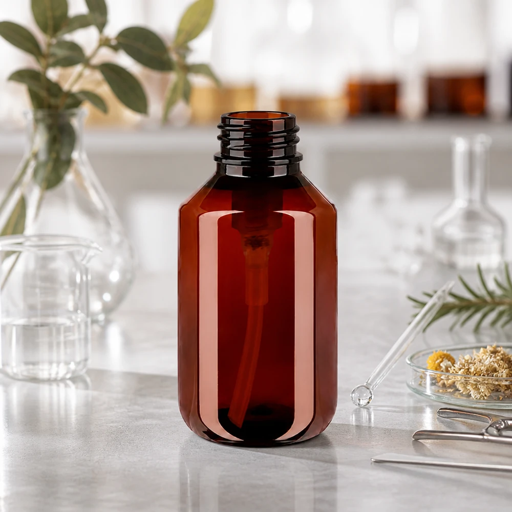 UV-schützende PET Flasche 100ml bernsteinfarben mit Gewindeöffnung für weisse Dispenserpumpe