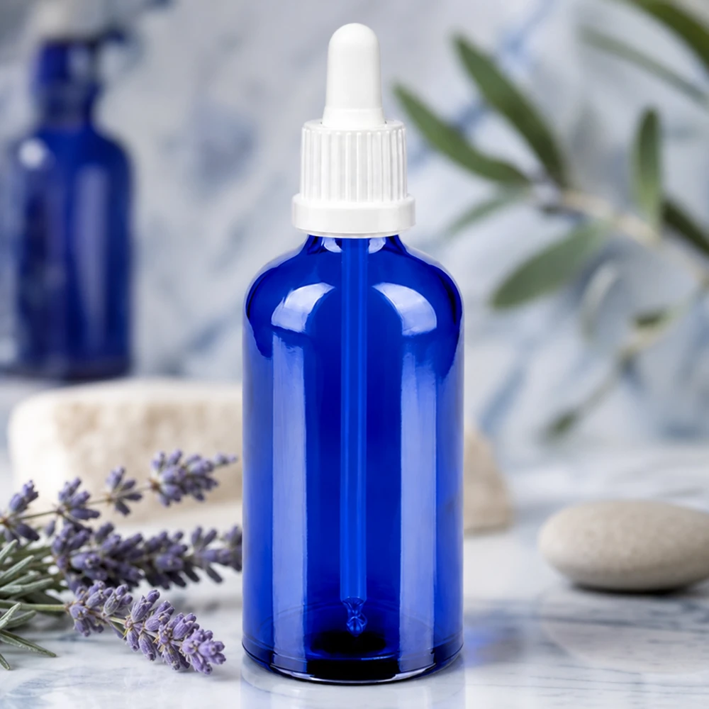 Elegancka niebieska szklana butelka 100 ml z ergonomiczną pipetą BlueLine UT18/100 ułatwiającą obsługę