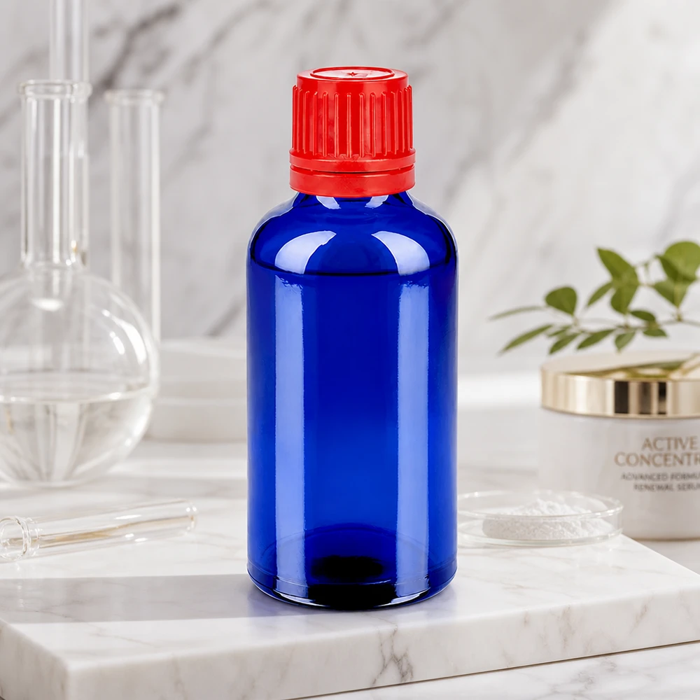 Butelka 50 ml 11 mm SV czerwony OV BlueLine UT18/50 Mała butelka 50 ml w eleganckim kobaltowym kolorze z praktyczną czerwoną zakrętką SV 11mm OV BlueLine UT18/50