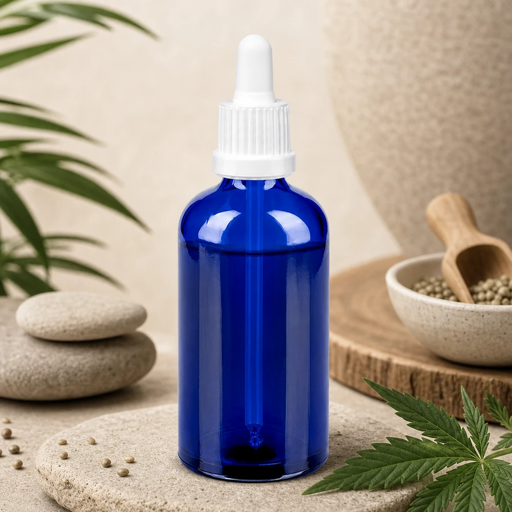 Butelka do leków płynnych 100 ml biała OV BlueLine UT18/100 Butelka z niebieskiego szkła o pojemności 100 ml z białą pipetą, idealna do oleju CBD i nalewek BlueLine UT18/100