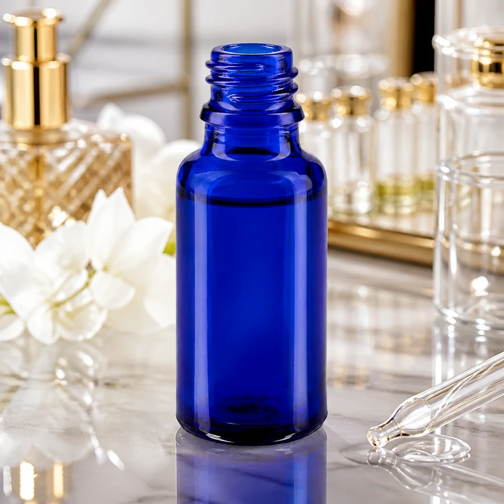 Elegancka butelka ApoGlas o pojemności 20 ml w kolorze głębokiego błękitu do kosmetyków i naturalnych środków leczniczych