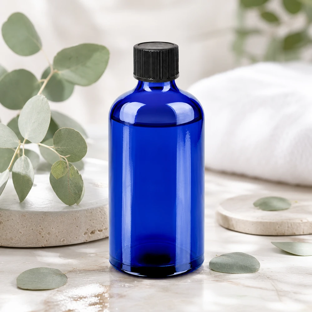 100 ml butelka z zakraplaczem 1 mm czarna STD BlueLine UT18/100 Wysokiej jakości butelka z niebieskiego szkła o pojemności 100 ml z precyzyjnym kroplomierzem 1 mm dla optymalnego dozowania składników aktywnych