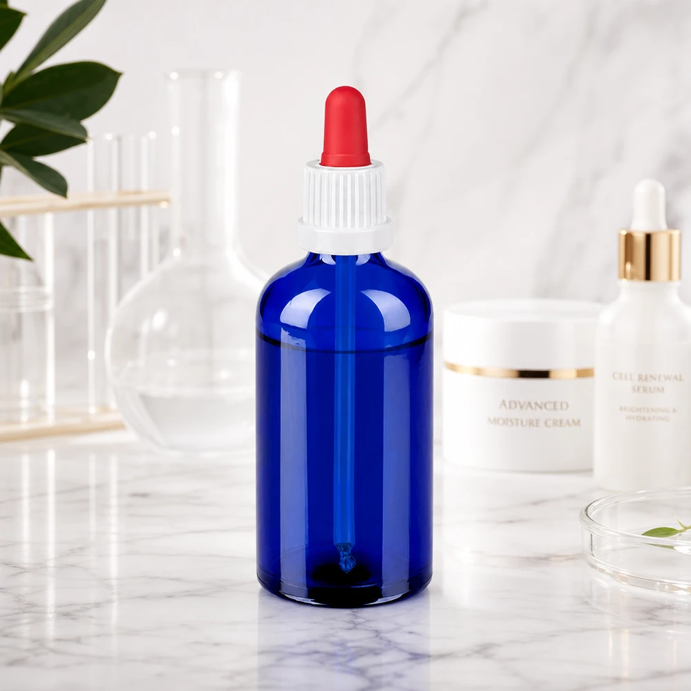 Butelka do leków płynnych 100 ml biała/czerwona OV BlueLine UT18/100 Kompaktowa butelka z zakraplaczem o pojemności 100 ml wykonana z wytrzymałego niebieskiego szkła do bezpiecznego przechowywania płynów