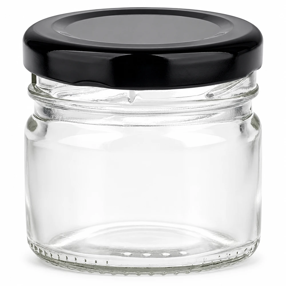 Okrągła szklanka 33 ml + czarna pokrywka BasicSeal UNiTWIST Okrągła szklanka o pojemności 33 ml z czarną pokrywką BasicSeal – pusta i przezroczysta na białym tle
