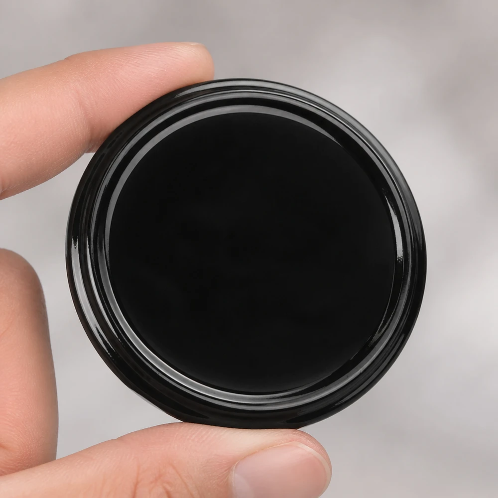 Pokrywka BasicSeal 82 mm, czarna, TO82, UNiTWIST, błyszcząca powierzchnia – zbliżenie
