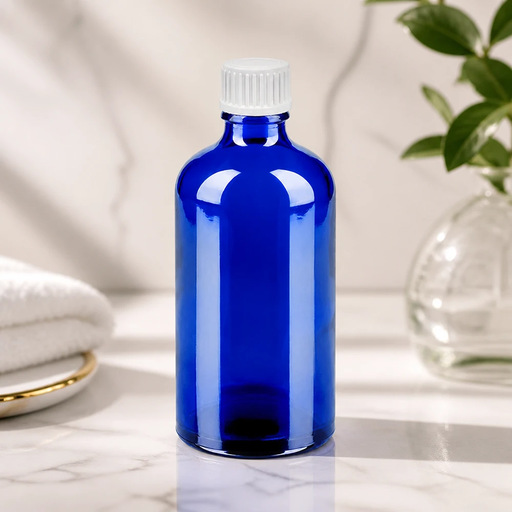 Butelka z kroplomierzem 100 ml 0,9 mm biały STD BlueLine UT18/100 Elegancka niebieska szklana butelka 100 ml z białym zakraplaczem do stylowego przechowywania BlueLine UT18