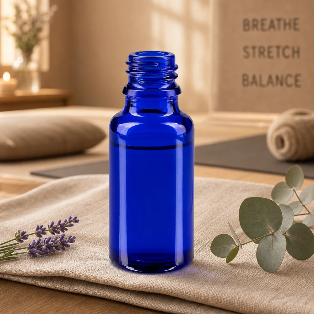 Butelka z zakraplaczem 20 ml DIN 18 NIEBIESKIE SZKŁO Kompaktowa butelka z niebieskiego szkła ApoGlas o pojemności 20 ml, idealna do kosmetyków naturalnych i domowych serum.