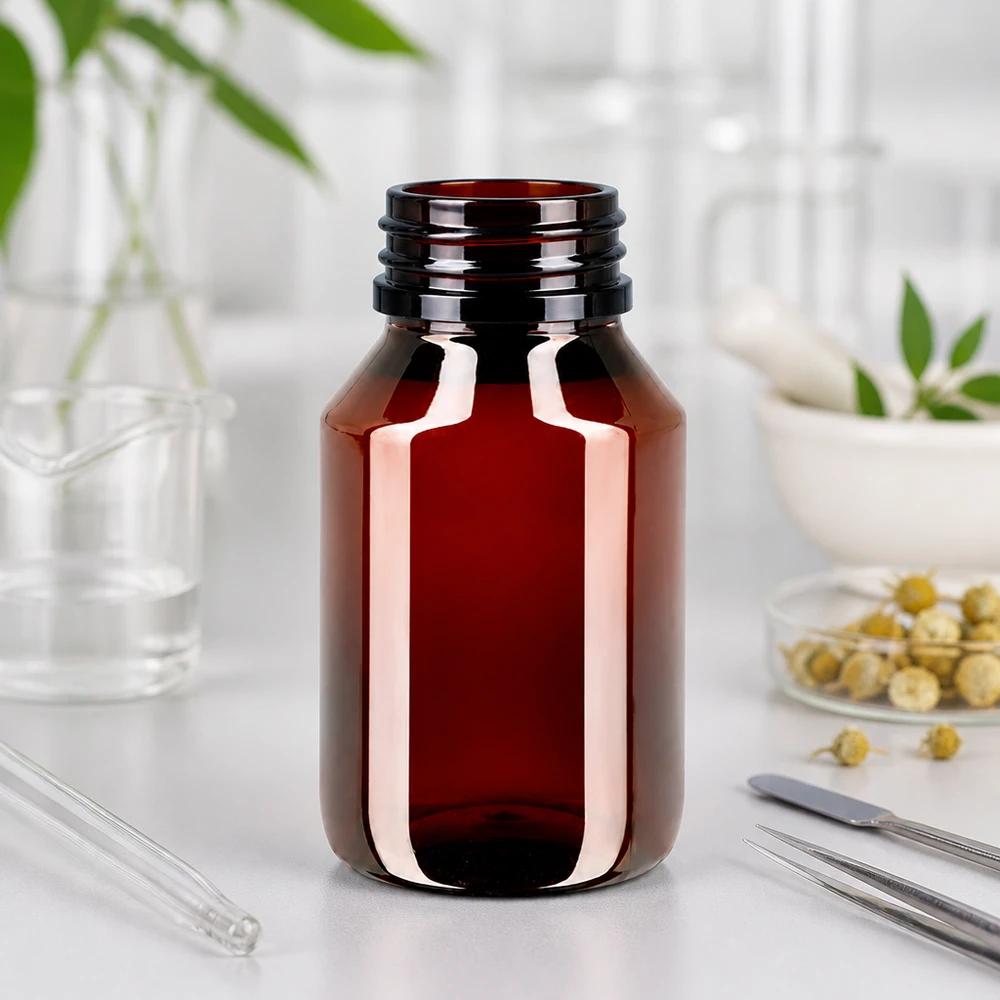 Kompaktowa butelka PET o pojemności 50 ml w kolorze brązowym z niebieską zakrętką, przeznaczona do zastosowań farmaceutycznych
