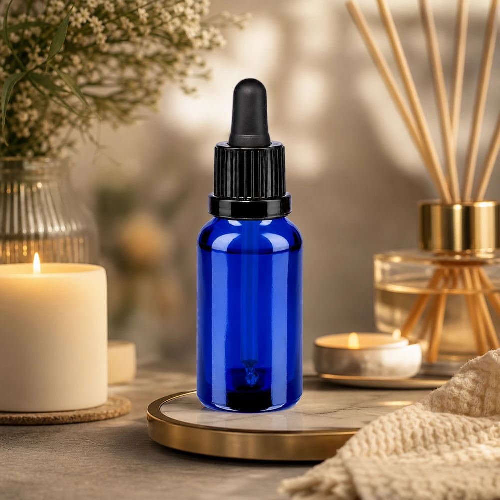 Kompaktowa butelka z pipetą o pojemności 20 ml w eleganckim niebieskim kolorze z praktycznym zakraplaczem do użytku domowego
