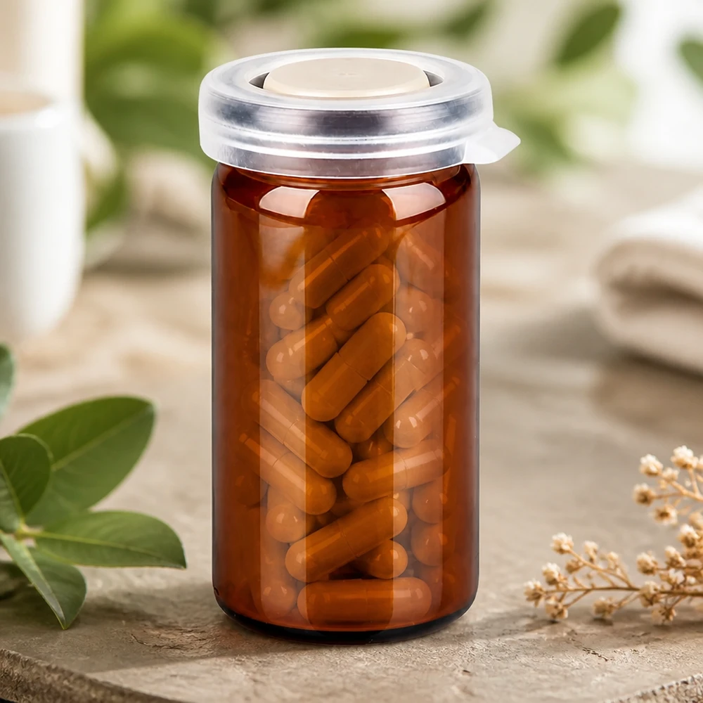 Brązowa buteleczka farmaceutyczna o pojemności 10 ml z zatrzaskową pokrywką, wypełniona kapsułkami na suplementy diety