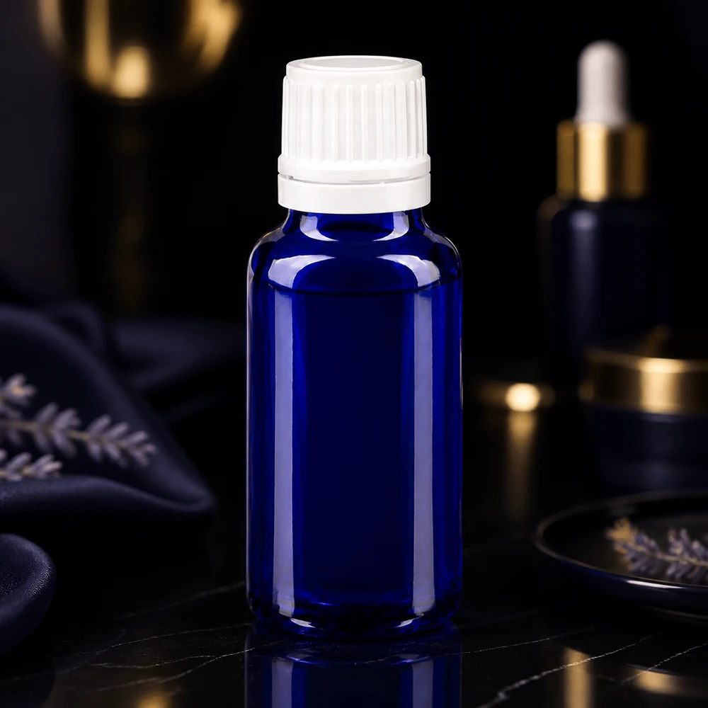 Butelka apteczna niebieska 20ml drip v. 1,2 mm biały OV Niebieska szklana buteleczka o pojemności 20 ml z białą zakrętką i kroplomierzem do olejków eterycznych