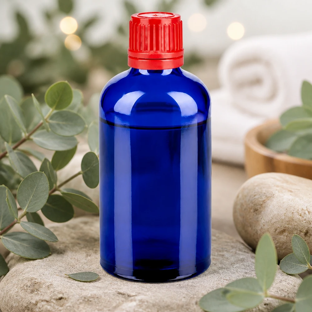 Wysokiej jakości szklana butelka 100 ml w kolorze kobaltowo-niebieskim z praktyczną zakrętką 11 mm SV w kolorze czerwonym