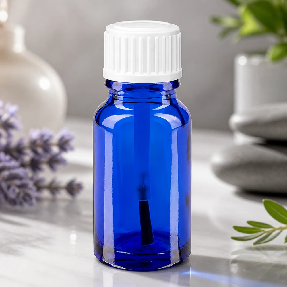 Butelka apteczna niebieska 10ml zakrętka biały pędzelek Kobaltowo-niebieska buteleczka z pędzelkiem o pojemności 10 ml, wykonana ze szkła farmaceutycznego, z białą nakrętką zabezpieczoną przed dziećmi