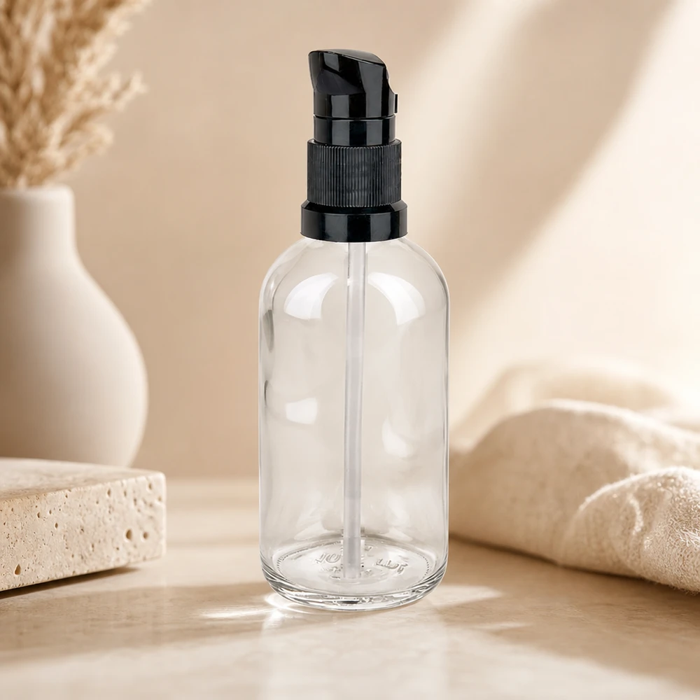 Pusta butelka ze szkła przezroczystego o pojemności 100 ml z czarną pompką dozującą ClearLine UT18 – butelka kosmetyczna z możliwością ponownego napełniania
