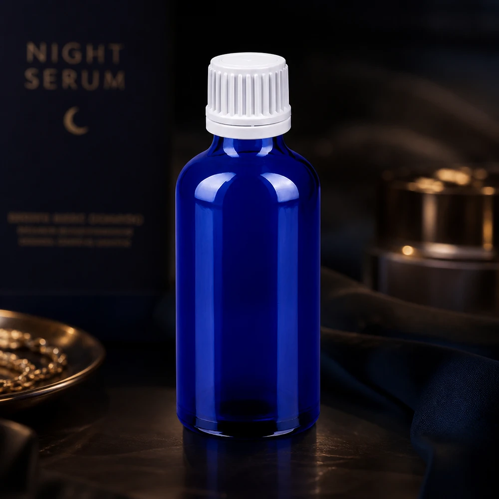 Elegancka niebieska szklana butelka o pojemności 50 ml z białym zakraplaczem do precyzyjnego dozowania płynów