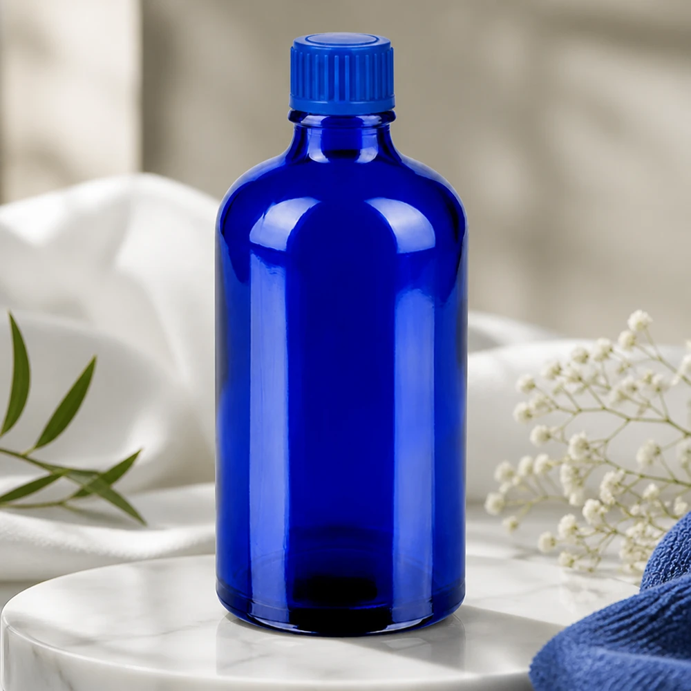 Butelka 100 ml 11 mm SV niebieski STD BlueLine UT18/100 Elegancka szklana butelka o pojemności 100 ml w kolorze głębokiego błękitu o ergonomicznym kształcie do użytku profesjonalnego