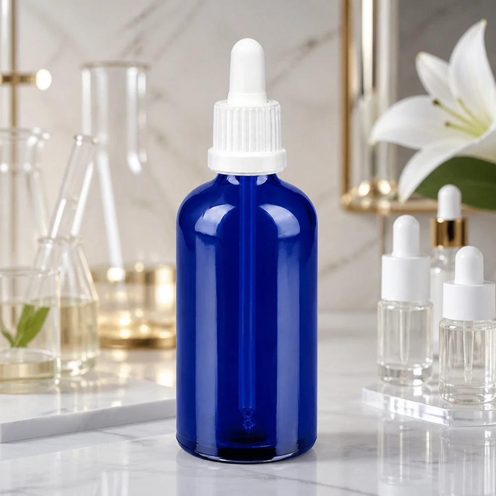 Butelka do leków płynnych 100 ml biała OV BlueLine UT18/100 Elegancka szklana butelka 100 ml w kolorze niebieskim z białą pipetą do stylowej prezentacji produktu BlueLine