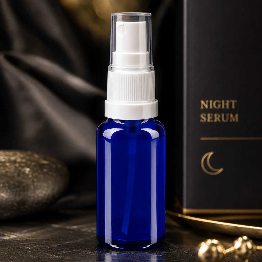 20 ml niebieska szklana buteleczka z atomizerem jako opakowanie na serum na noc – elegancka buteleczka kosmetyczna ApoGlas