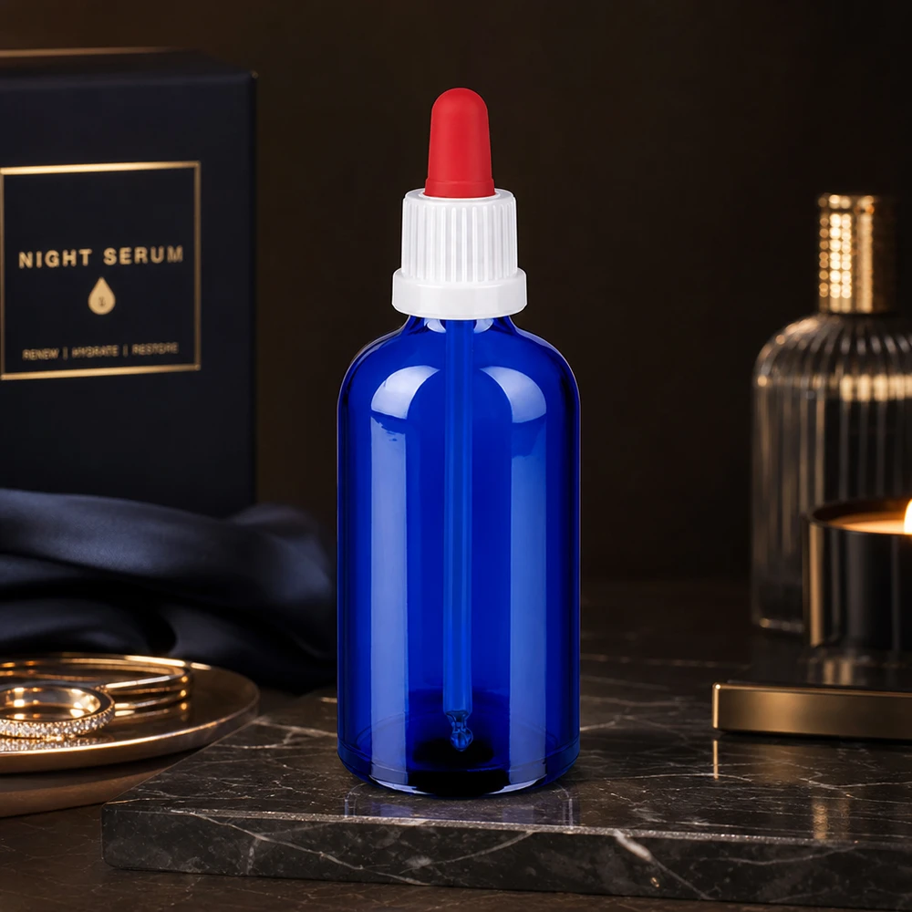 Chroniąca przed światłem szklana butelka 100 ml w kolorze kobaltowo-niebieskim z zakrętką do pipetowania substancji wrażliwych na światło