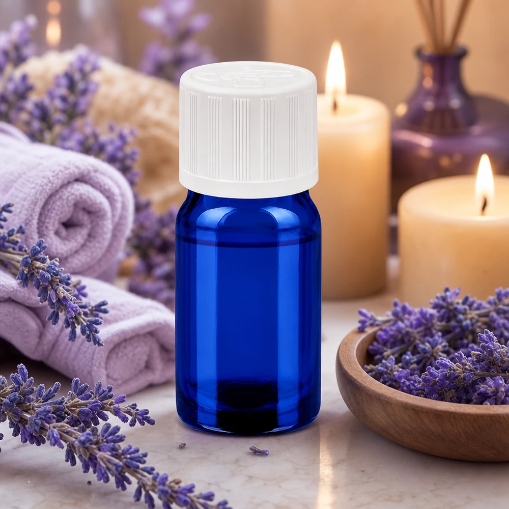 Mała niebieska szklana butelka 5 ml z zakrętką zabezpieczającą przed dziećmi, idealna do olejków eterycznych i aromaterapii