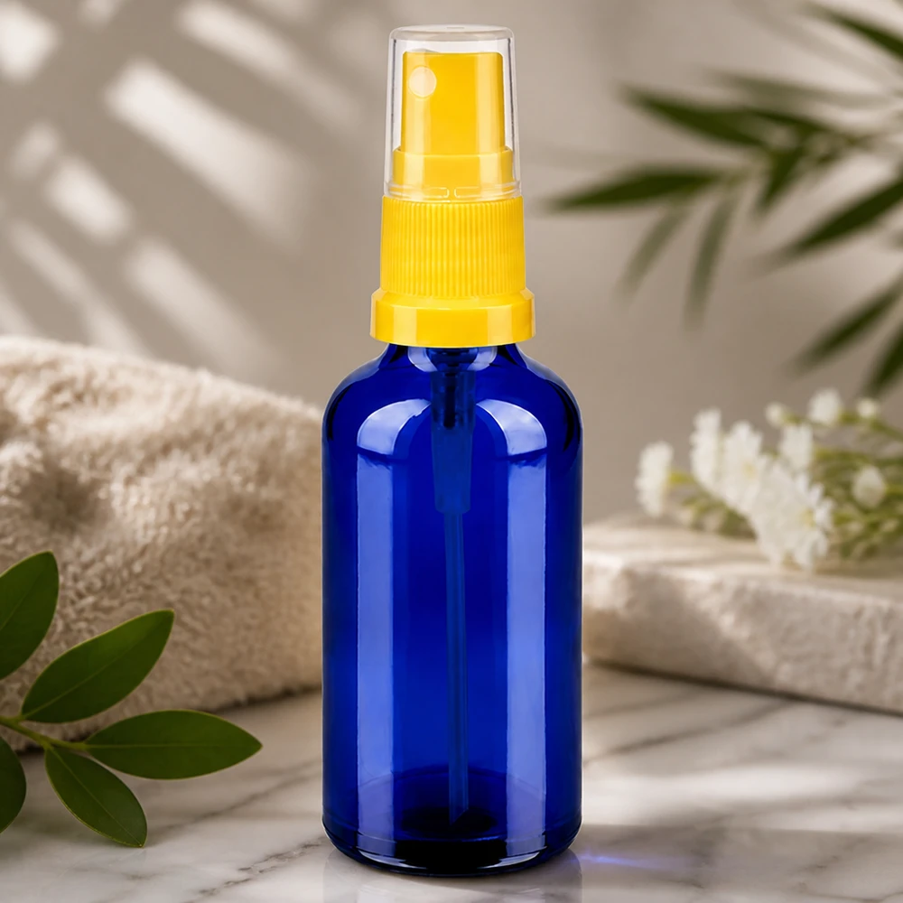 50 ml butelka ze spryskiwaczem żółta/przezroczysta STD BlueLine UT18/50 Profesjonalna butelka z rozpylaczem 50 ml z serii BlueLine z ochroną UV dzięki niebieskiemu szkłu i żółtej głowicy rozpylającej